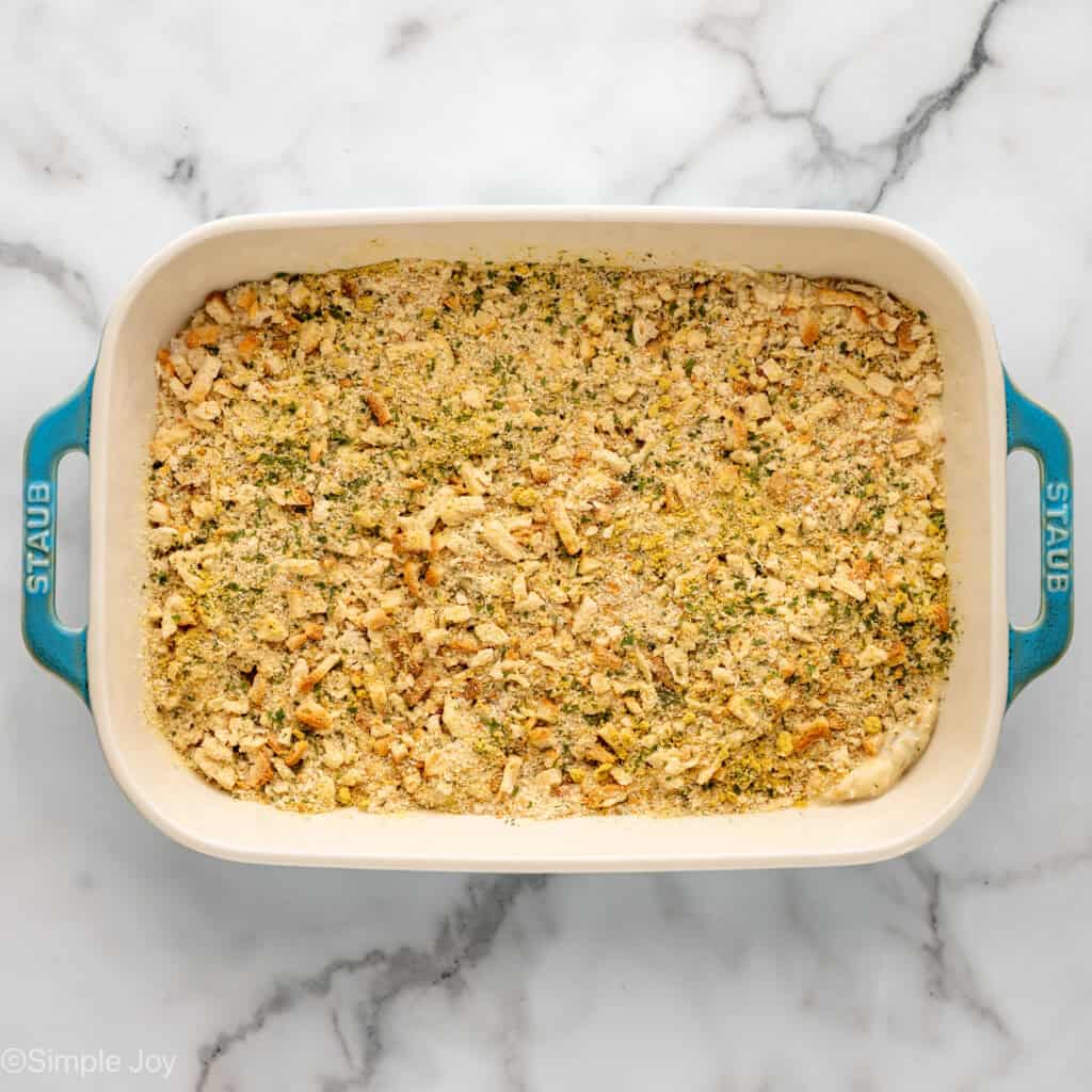 Overhead view of a baking dish with stuffing mix for Chicken and Stuffing Casserole recipe
