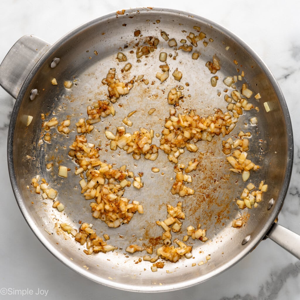 Overhead view of a skillet of ingredients for Chicken Penne Pasta recipe