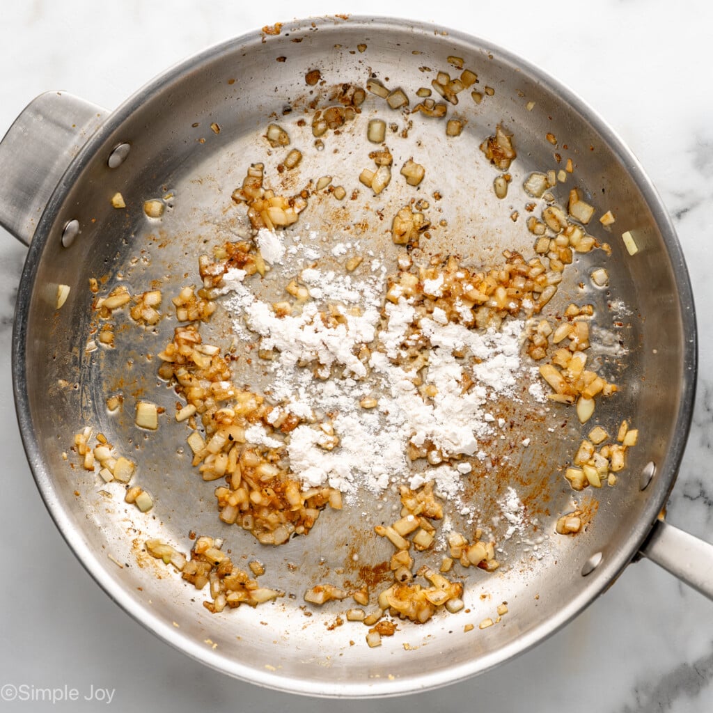 Overhead view of a skillet of ingredients for Chicken Penne Pasta recipe