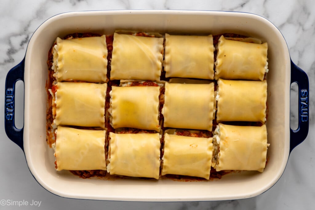 Overhead view of baking dish of Lasagna Roll Ups recipe in progress