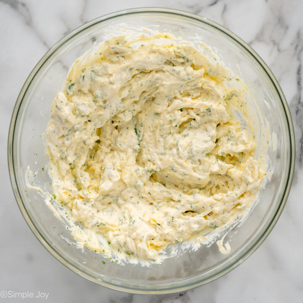 Overhead view of a mixing bowl of filling for Lasagna Roll Ups recipe