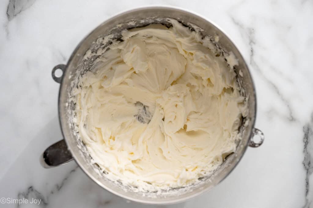Overhead view of a mixing bowl of Lemon Sugar Cookie Bars frosting recipe