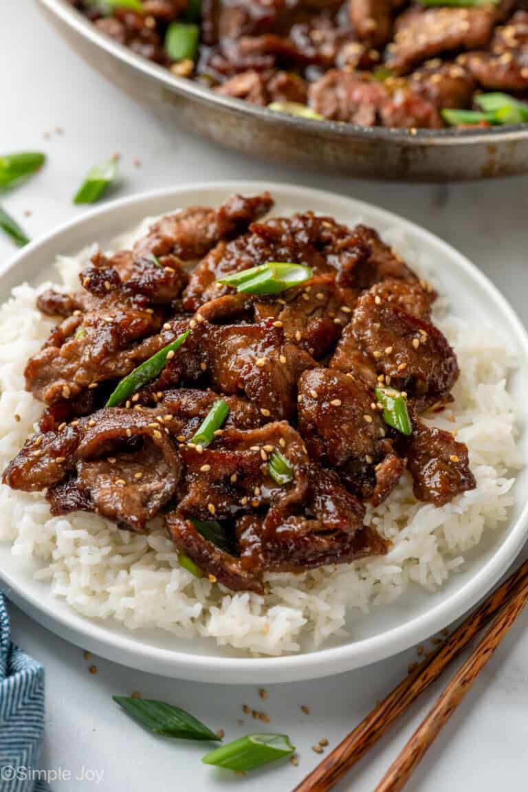 plate of Mongolian Beef over white rice topped with diced green onion