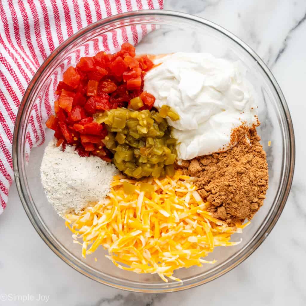 Overhead of glass bowl of Boat Dip ingredients
