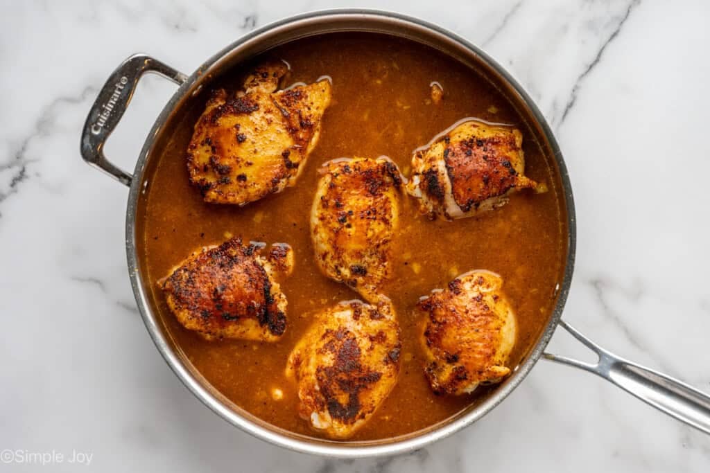 overhead of skillet of chicken and rice recipe ingredients
