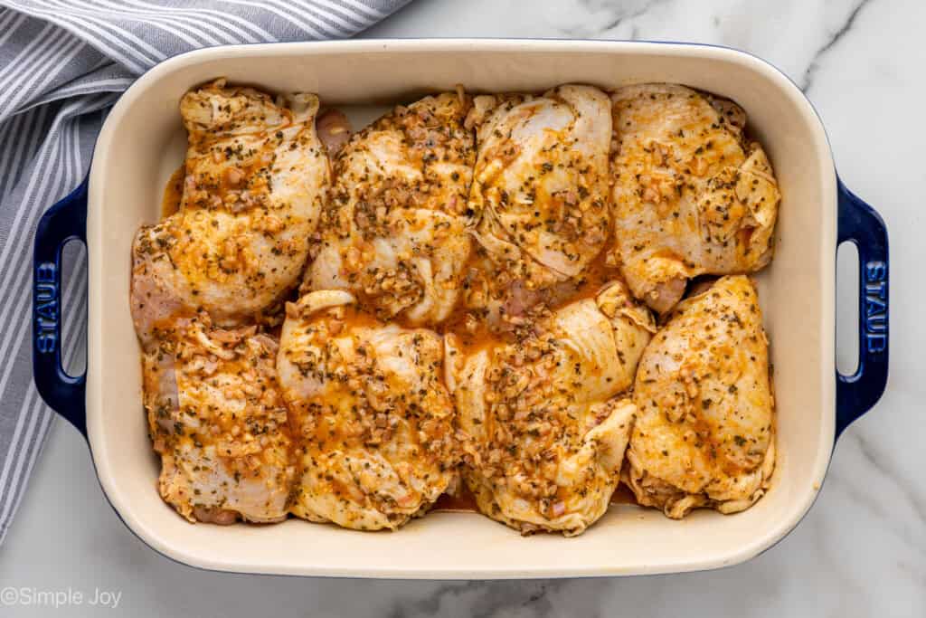 Overhead of baking dish of Greek Chicken recipe ingredients