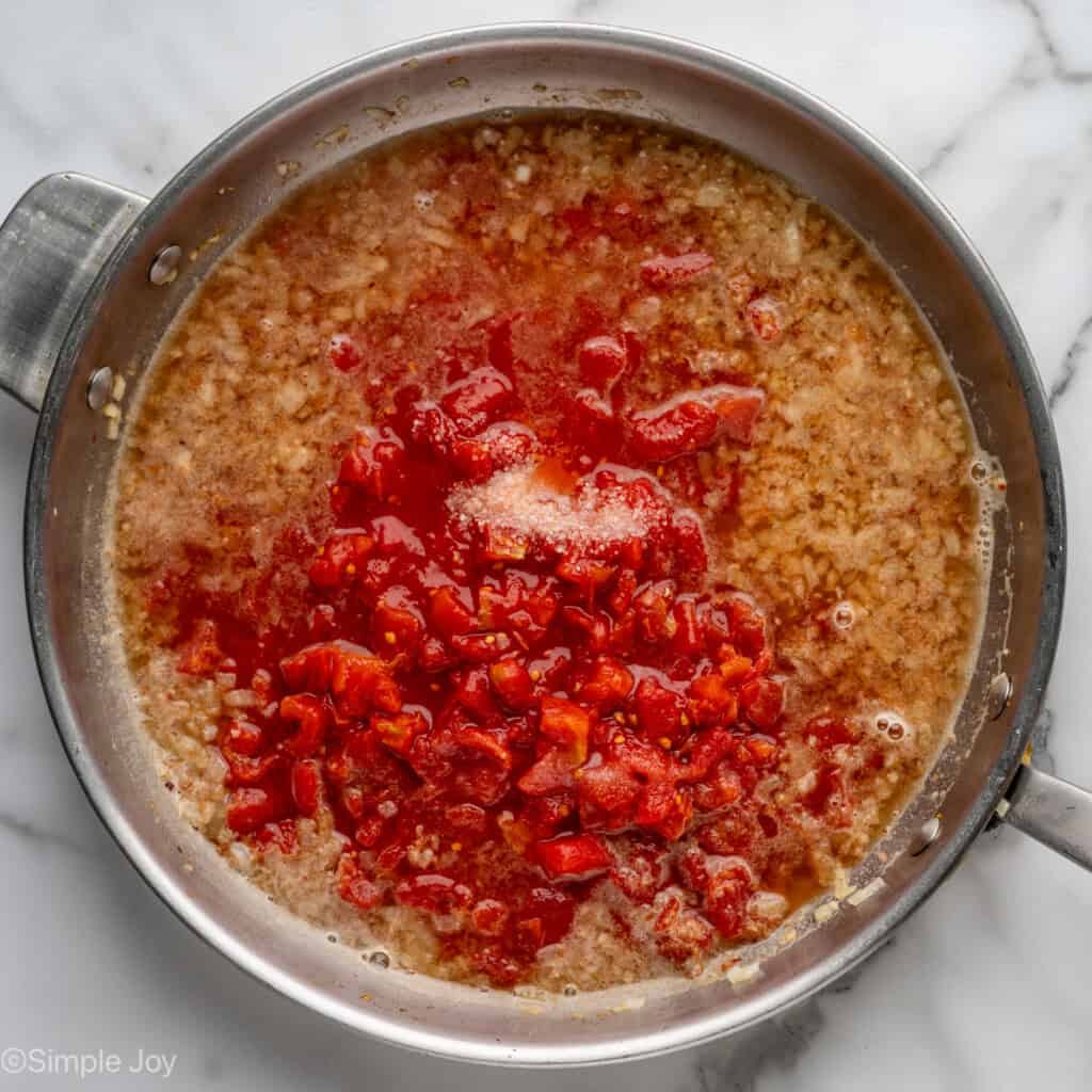 Overhead of skillet of Shrimp Fra Diavolo sauce ingredients