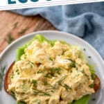 Pinterest graphic for Cottage Cheese Egg Salad. Says "the best Cottage Cheese Egg Salad simplejoy.com" Image shows plate of Cottage Cheese Egg Salad on a piece of bread, garnished with fresh dill