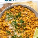 Pinterest graphic for Mexican Street Corn Dip. Says "the best Mexican Street Corn Dip simplejoy.com" Image shows overhead of bowl of Mexican Street Corn Dip garnished with chopped cilantro and lime wedges, tortilla chips sitting beside.