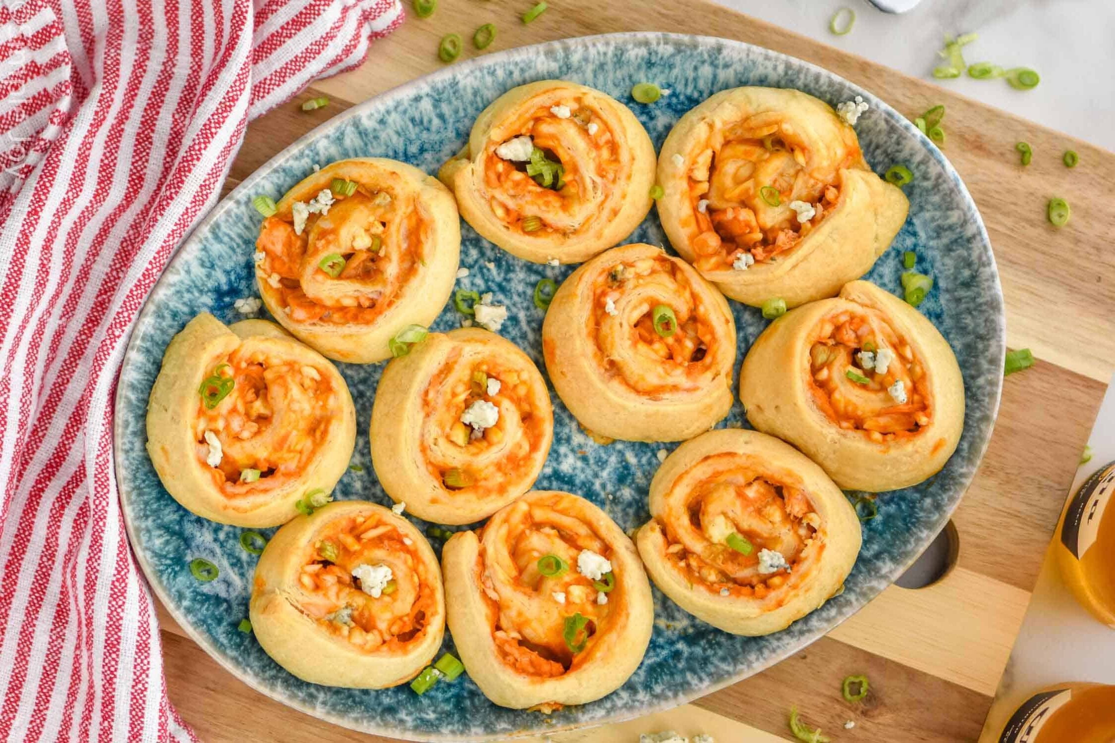 overhead of a platter of buffalo chicken pinewheels