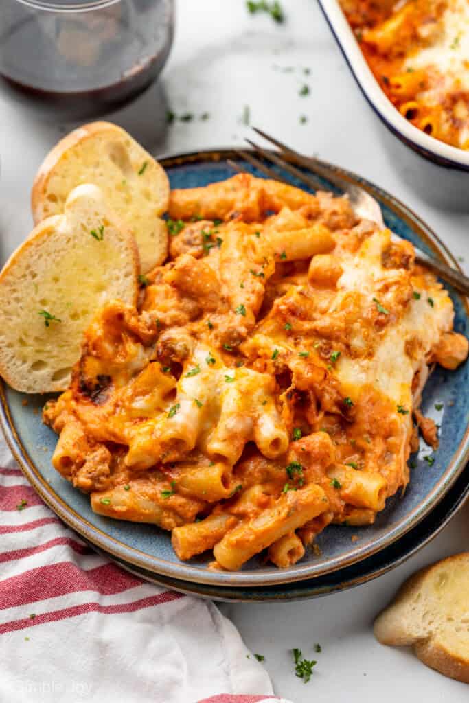 Plate of Five Ingredient Baked Ziti with fork and two slices of bread