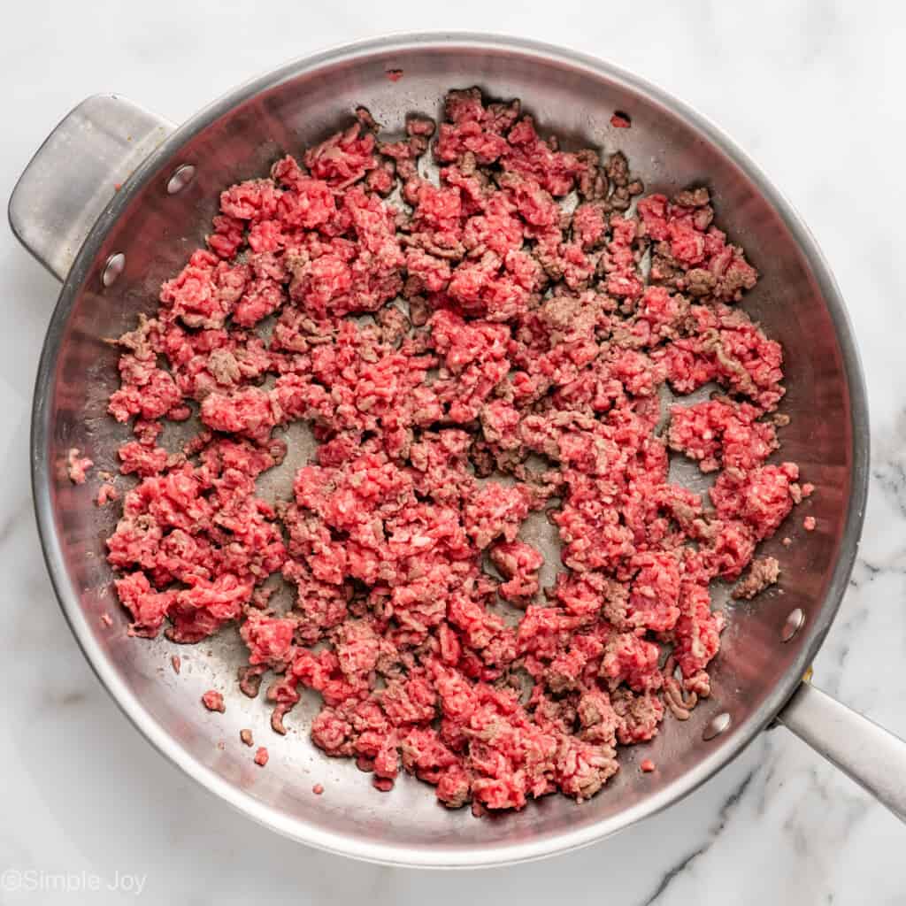 Overhead of skillet of ground beef to make American Chop Suey recipe