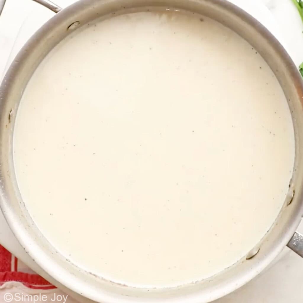 Overhead of saucepan of country gravy ingredients to make Chicken Fried Steak recipe