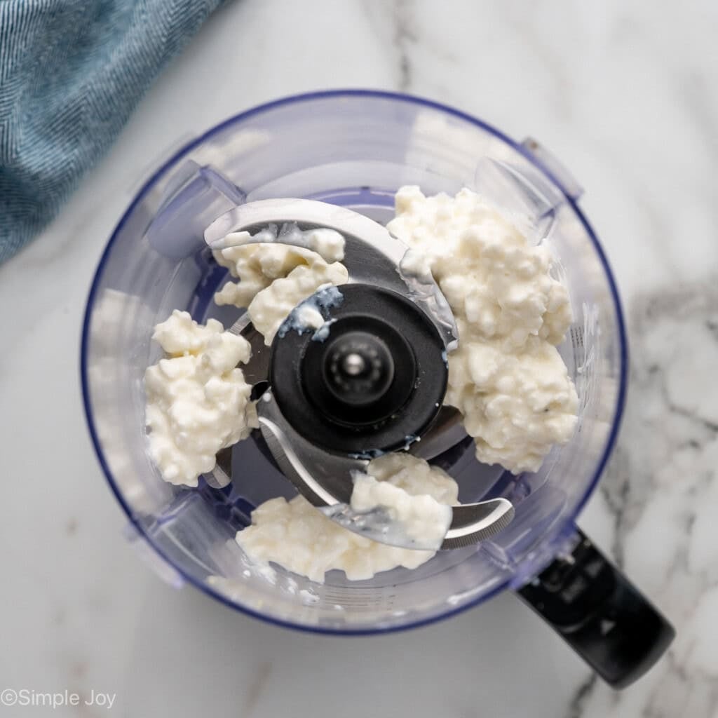 overhead of food processor with cottage cheese to make Cottage Cheese Egg Salad