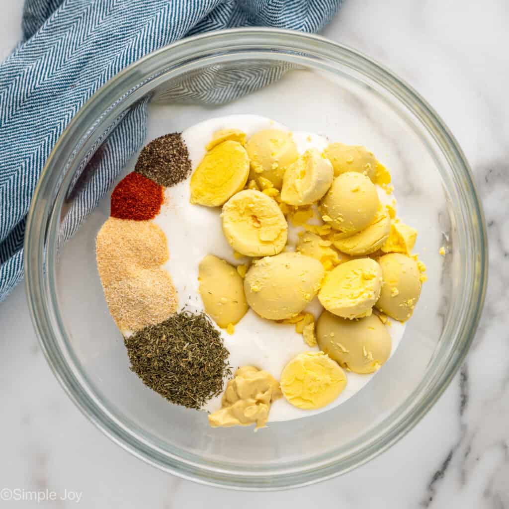 Overhead of glass bowl of Cottage Cheese Egg Salad ingredients