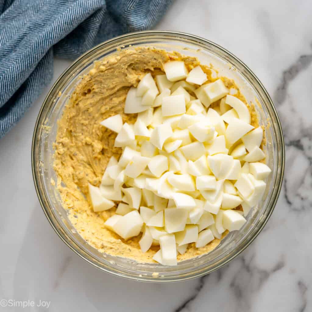 Overhead of glass bowl of Cottage Cheese Egg Salad ingredients