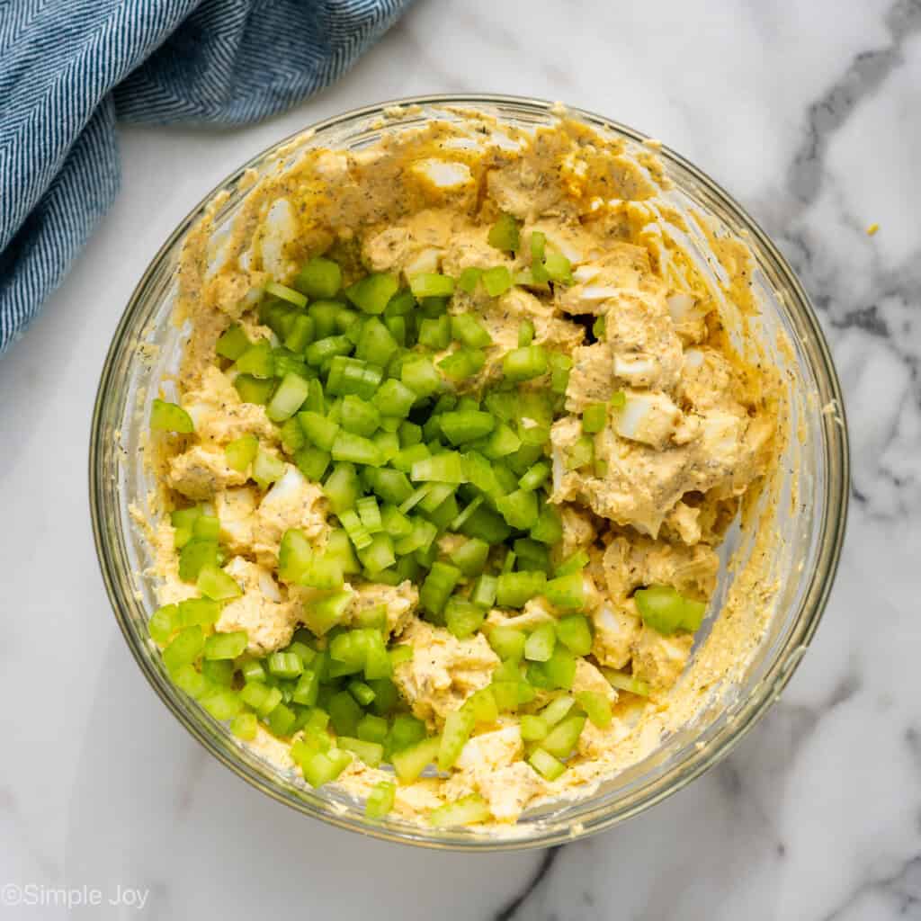 Overhead of glass bowl of Cottage Cheese Egg Salad ingredients