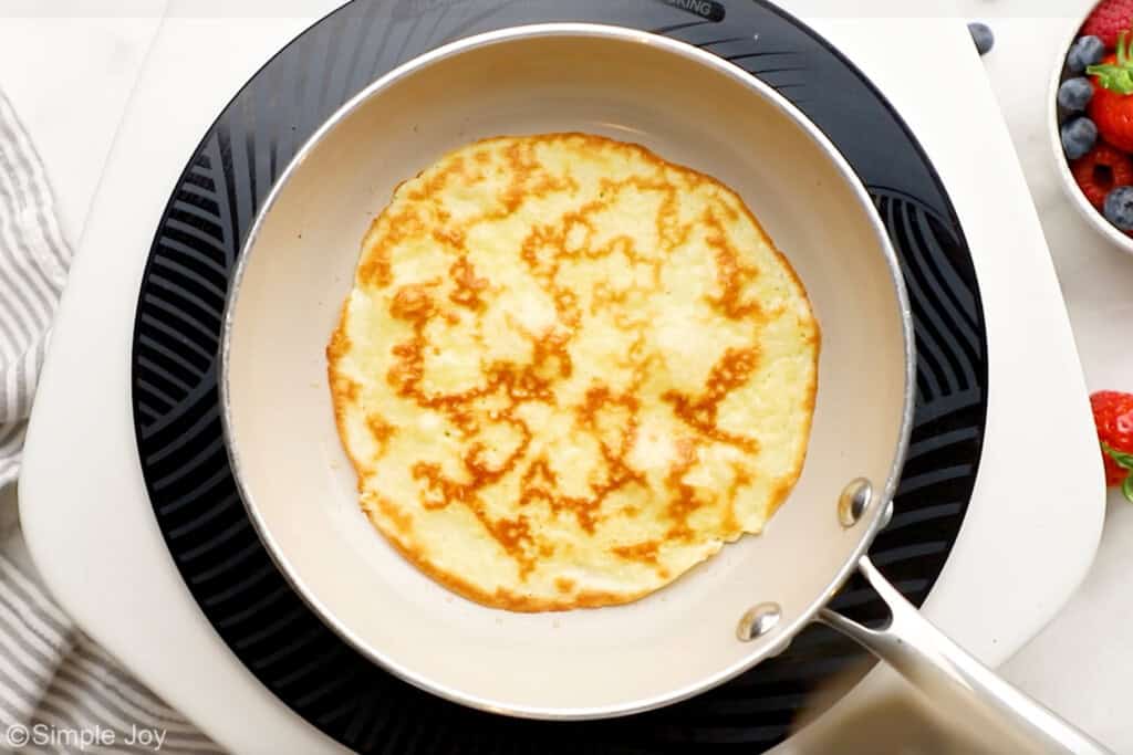 Overhead of cooked crepe in a skillet
