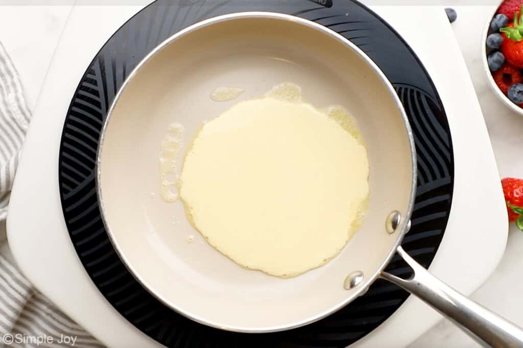 Overhead of homemade crepe batter in a skillet