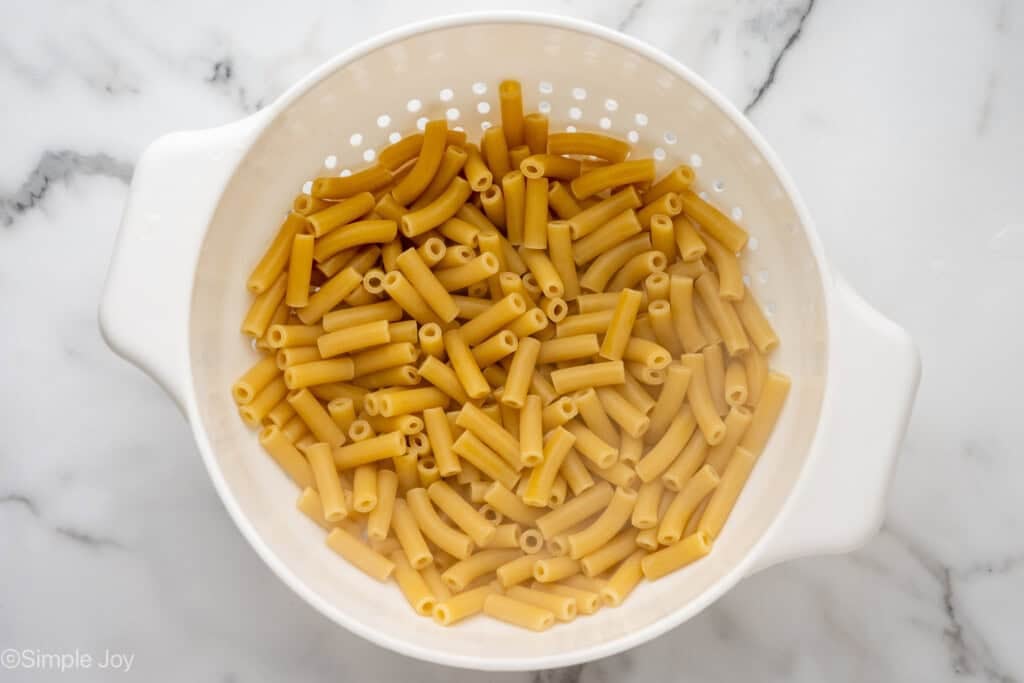 Overhead of colander of cooked pasta to make Five Ingredient Baked Ziti recipe