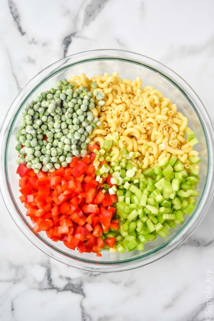 overhead of bowl of Macaroni Salad ingredients