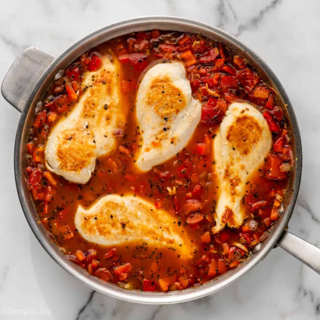 Overhead of skillet of Mediterranean Chicken and Orzo skillet