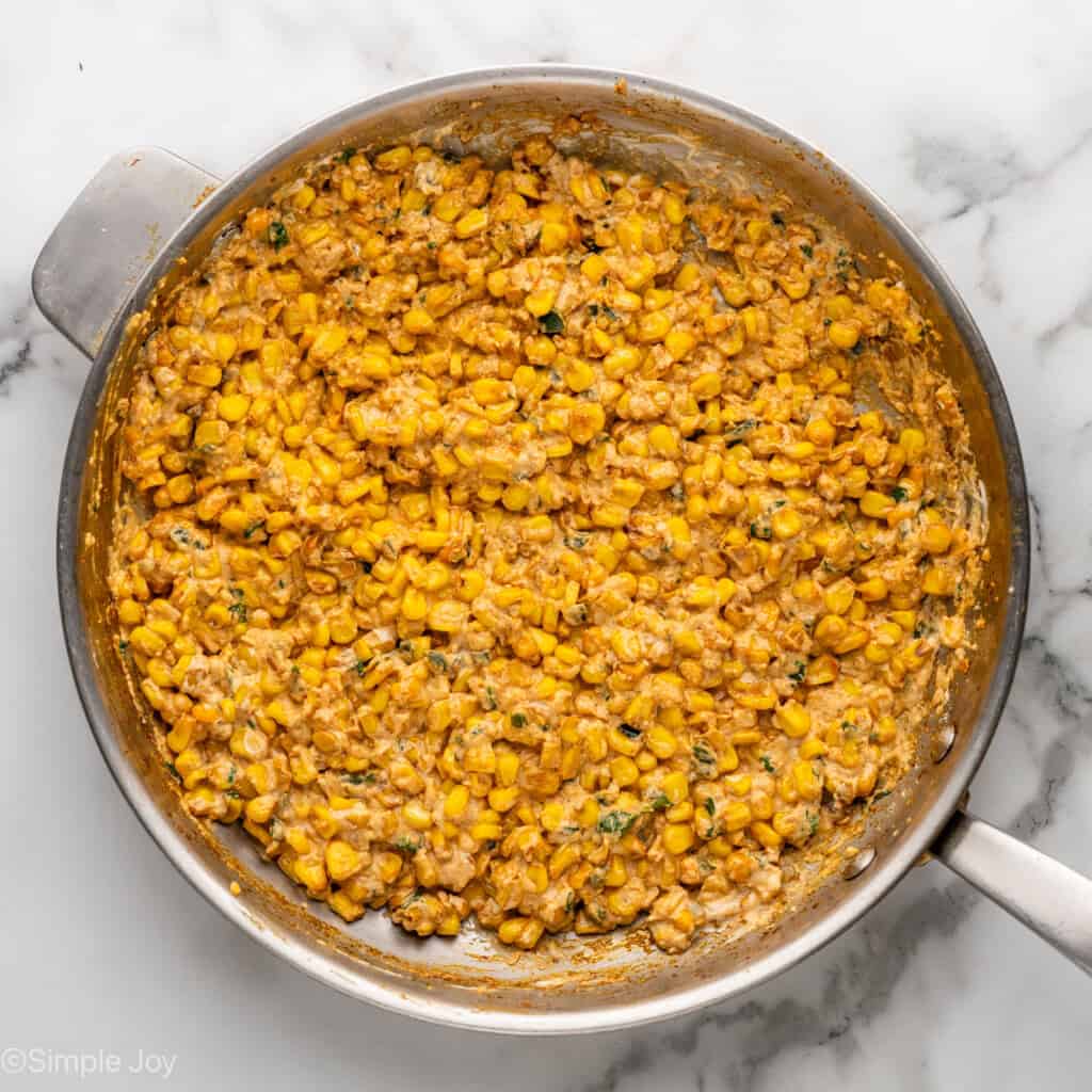 Overhead of skillet of Mexican Street Corn Dip ingredients