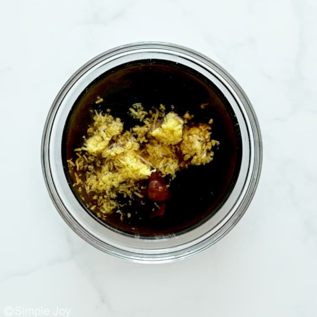 overhead of glass bowl of vegetable stir fry sauce ingredients