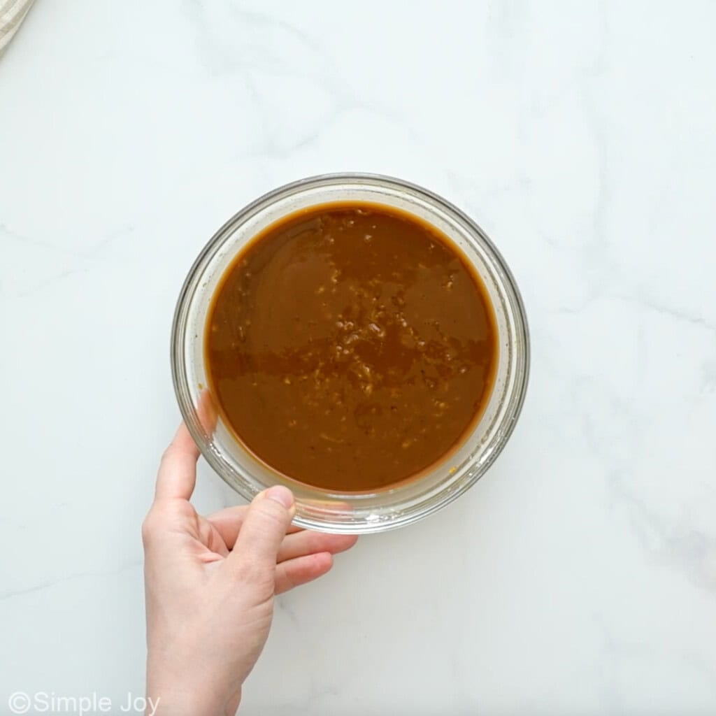 overhead of glass bowl of vegetable stir fry sauce ingredients