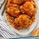 Pinterest graphic for Chicken Cacciatore. Image shows overhead of platter of Chicken Cacciatore and spaghetti. Says "Chicken Cacciatore simplejoy.com"