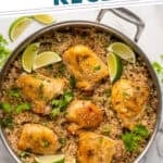 Pinterest graphic for One Pot Coconut Lime Chicken. Says "One Pot Coconut Chicken & Rice simplejoy.com" Image shows overhead of skillet of One Pot Coconut Lime Chicken and rice garnished with cilantro and lime wedges