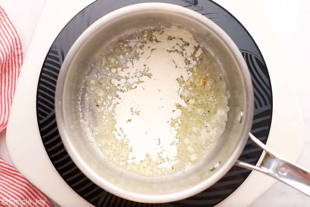 Overhead of saucepan of chicken cordon bleu sauce ingredients