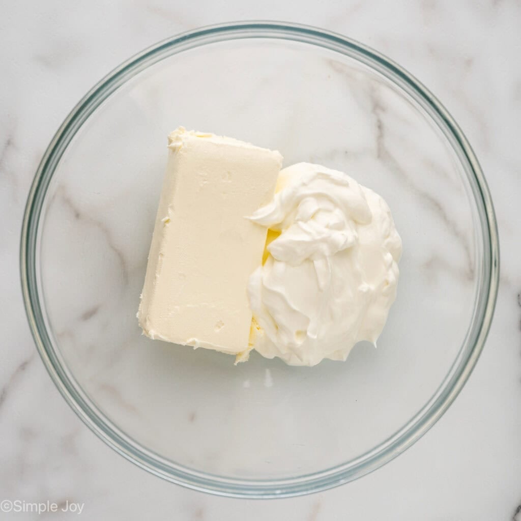 Overhead of glass bowl of crack dip ingredients