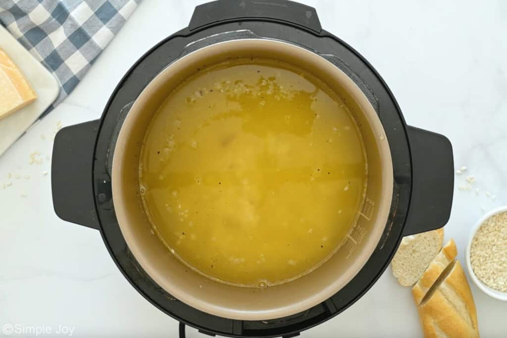 Overhead of instant pot of instant pot risotto recipe ingredients