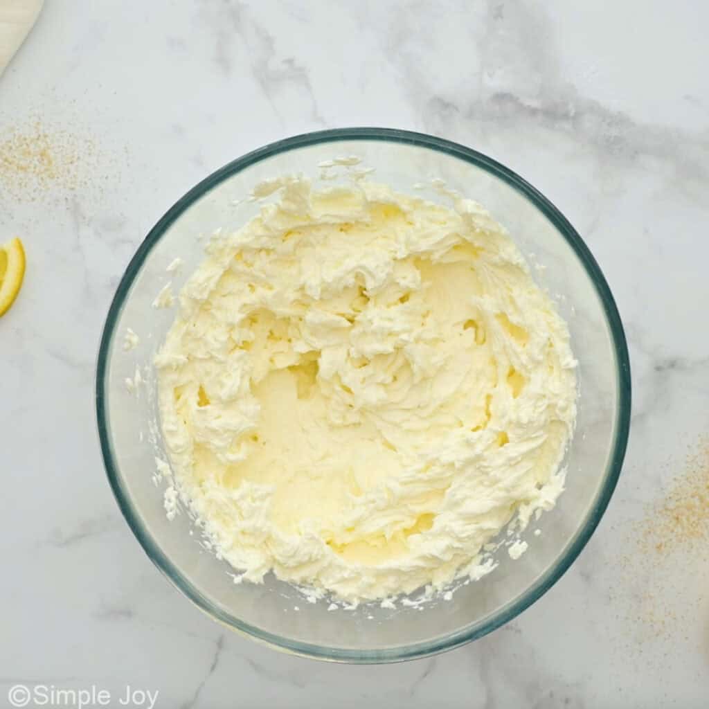 Overhead of bowl of lemon cheesecake ingredients