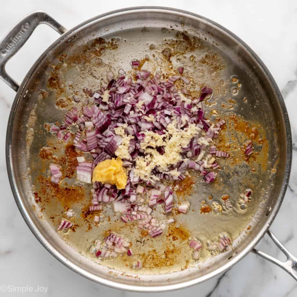 Overhead of skillet of One Pot Coconut Lime Chicken ingredients