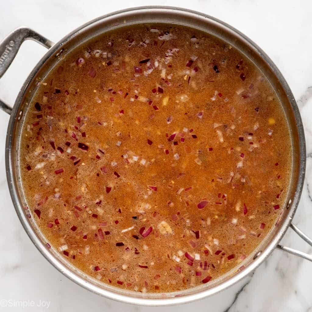 Overhead of skillet of One Pot Coconut Lime Chicken ingredients