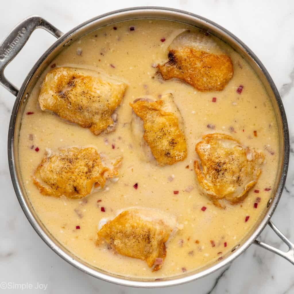 Overhead of saucepan of One Pot Coconut Lime Chicken ingredients