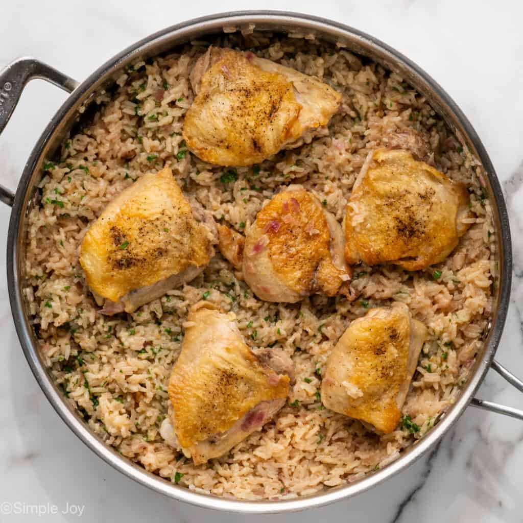 Overhead of skillet of One Pot Coconut Lime Chicken and rice