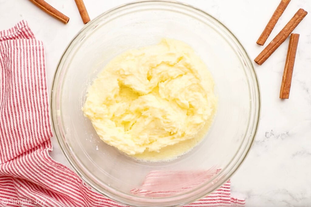 Overhead of glass bowl of Snickerdoodles ingredients