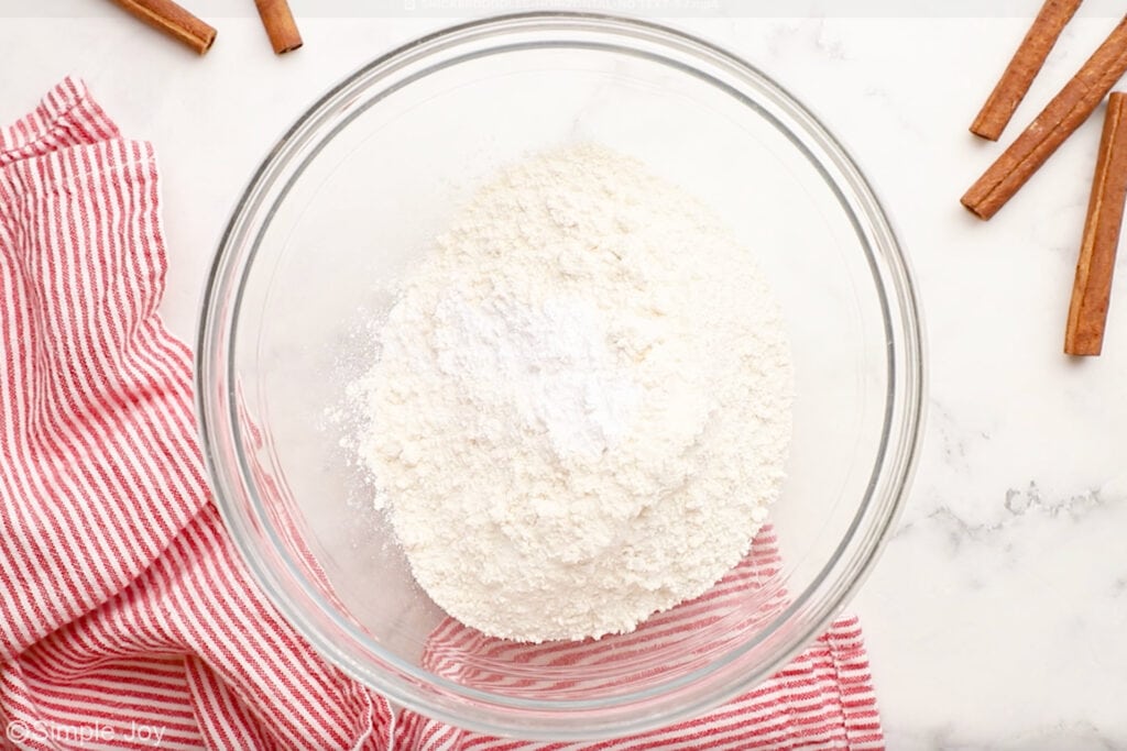 Overhead of glass bowl of Snickerdoodles ingredients