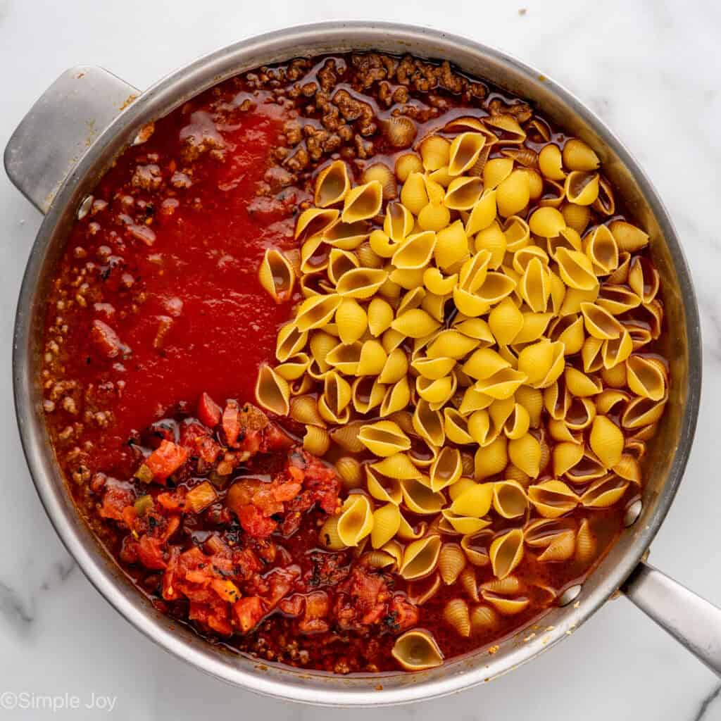 Overhead of skillet of One Pan Cheesy Taco Pasta ingredients