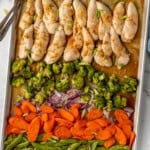 Overhead of sheet pan Honey Garlic Chicken and Vegetables with two forks
