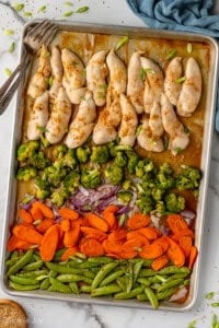 Overhead of sheet pan Honey Garlic Chicken and Vegetables with two forks