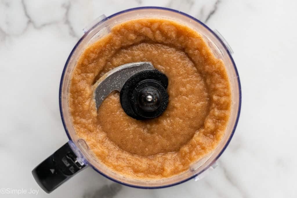 Overhead of food processor of homemade applesauce ingredients