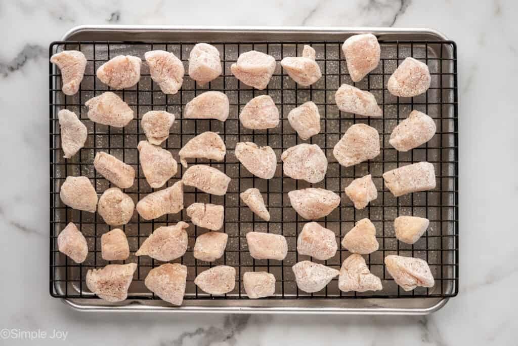 Overhead of Baked Orange Chicken ingredients on a wire rack over a baking sheet