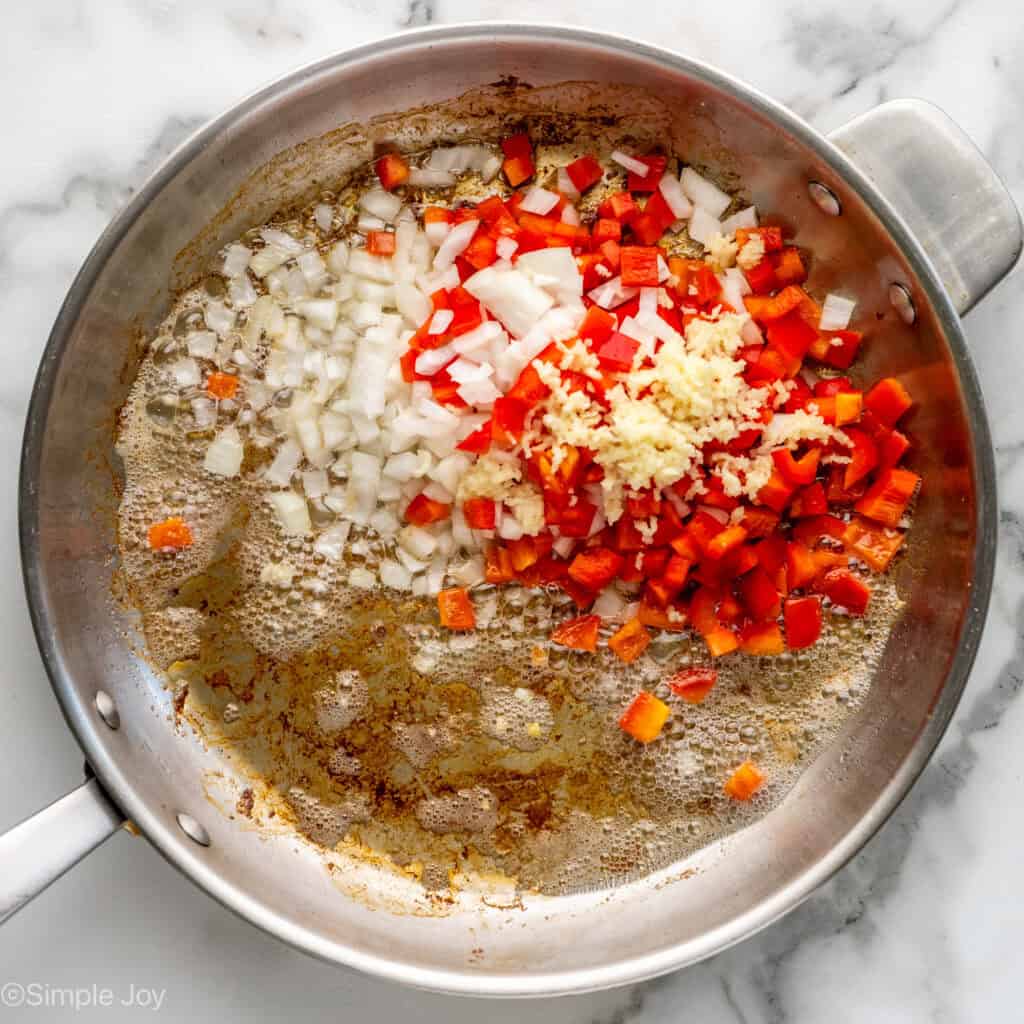Overhead of skillet of Breakfast Burrito ingredients