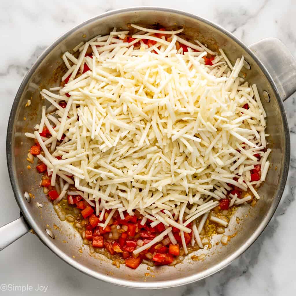 Overhead of skillet of Breakfast Burrito ingredients