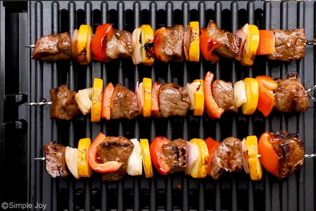 Overhead of steak kabobs on a grill