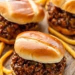 Pinterest graphic for BBQ Sloppy Joes. Says "the best BBQ Sloppy Joes simplejoy.com" Image shows BBQ Sloppy Joes on buns with french fries